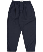 Load image into Gallery viewer, Universal Works Tropical Suiting Pleated Track Pant Navy
